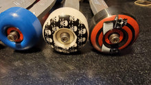 Load image into Gallery viewer, Custom Aluminum X-Maxx Wheelie Bar Bar with custom skateboard wheels